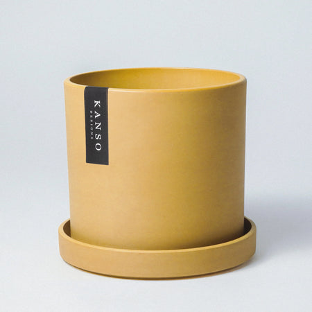Mustard yellow Signature Stone planter with saucer