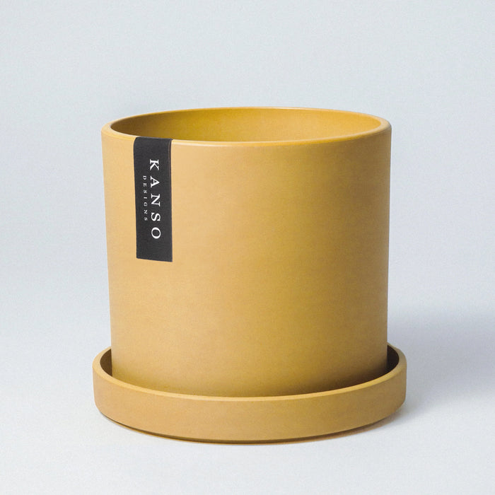 Mustard yellow Signature Stone planter with saucer