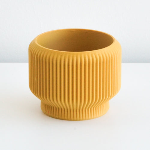 Mustard Cedar planter with a ribbed finish