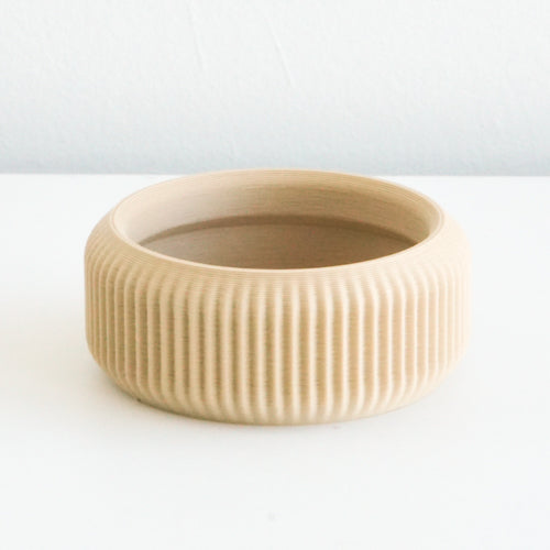 Tan Cedar saucer with a ribbed finish