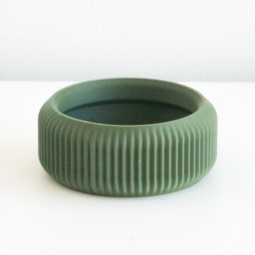 Olive Cedar saucer with a ribbed finish