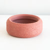 Salmon Cedar saucer with a textured finish