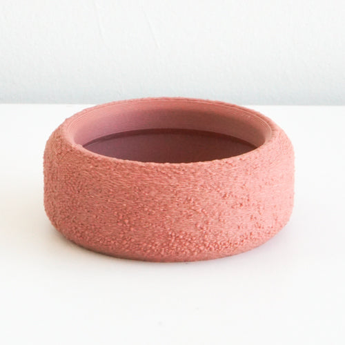 Salmon Cedar saucer with a textured finish