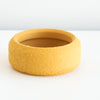 Mustard Cedar saucer with a textured finish