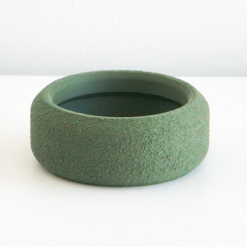 Olive Cedar saucer with a textured finish