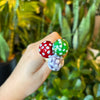 Hand holding three glass mushroom spikes