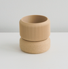 Tan Cedar planter stacked on its matching saucer
