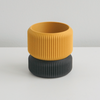 Mustard Cedar planter on a black ribbed saucer