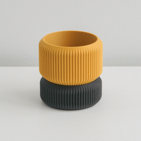 Mustard Cedar planter on a black ribbed saucer