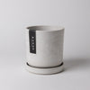 Empty white Signature Stone planter with matching tray