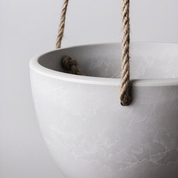 Close-up of a white Signature Stone hanging bowl