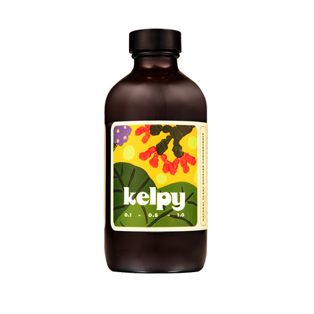 Brown glass bottle of Kelpy Plant Growth Booster with a yellow label