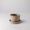 Empty small coffee bean husk planter with saucer