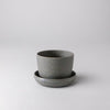 Empty small wheat husk planter with saucer