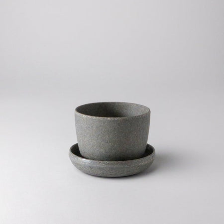 Empty small wheat husk planter with saucer